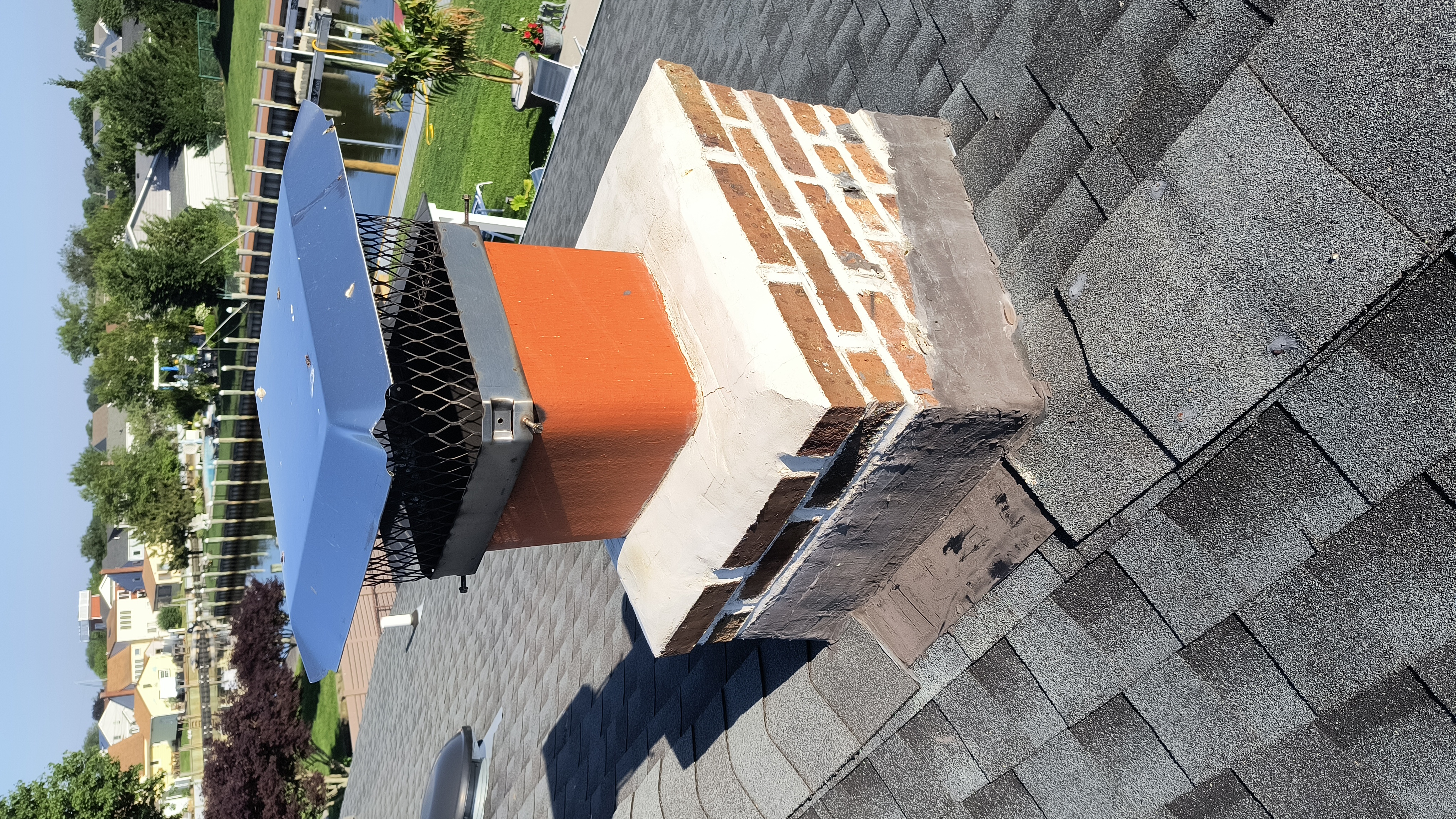 Full chimney masonry rebuild and restoration in Bayville, NY