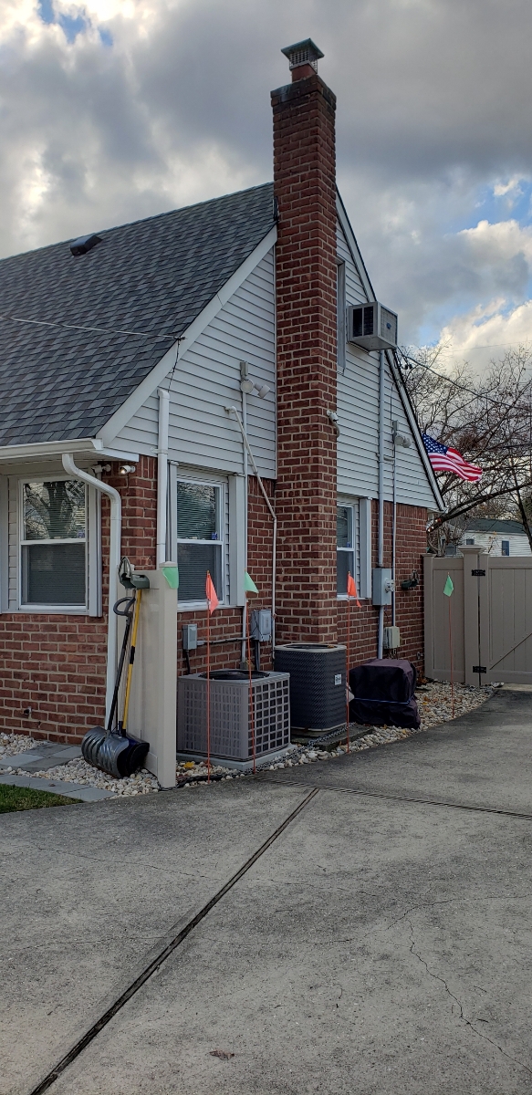 Professional chimney repointing restoring brick joints in Bayville, NY