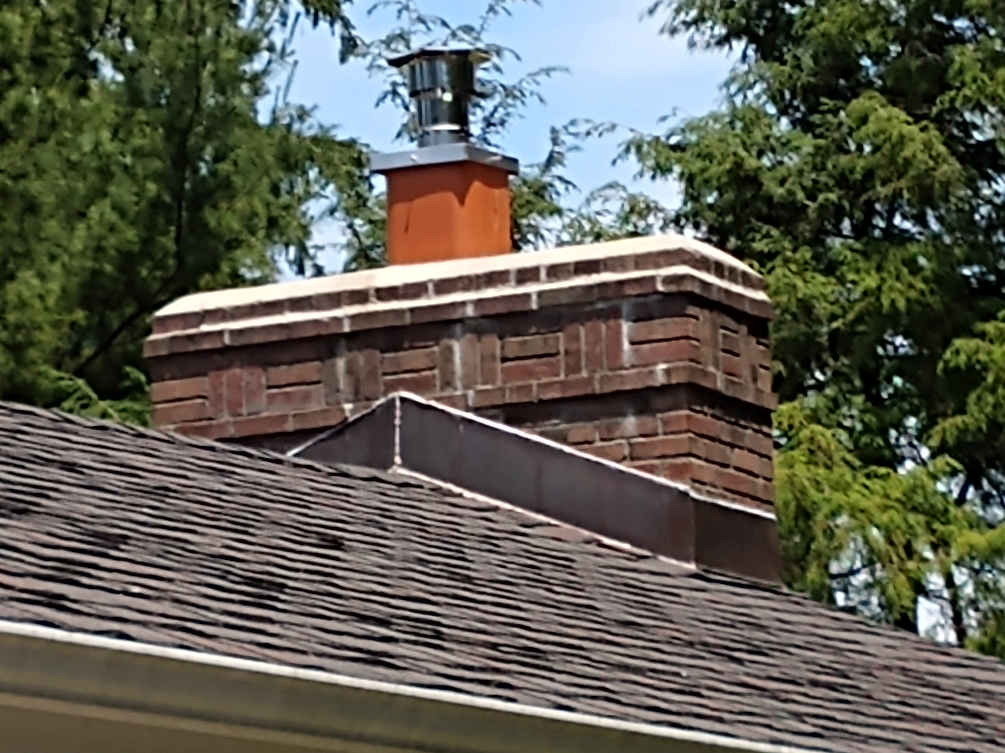 Stainless steel chimney cap with animal guard in Bayville, New York